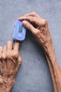 senior young women hand using pulse oximeter Royalty Free Stock Photo