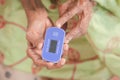 senior young women hand using pulse oximeter Royalty Free Stock Photo