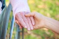 Senior and Young Women Holding Hands Royalty Free Stock Photo