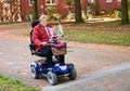 Seniorin with electric scooter