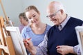 Seniors Attending Painting Class With Teacher Royalty Free Stock Photo