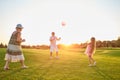 Seniors with child playing ball. Royalty Free Stock Photo