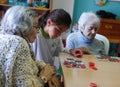 Seniors and childs during therapeutical activities on a nursing home in Mallorca detail Royalty Free Stock Photo