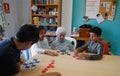 Seniors and childs during therapeutical activities on a nursing home in Mallorca