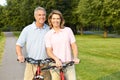 Seniors couple biking Royalty Free Stock Photo