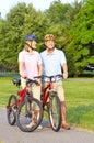 Seniors couple biking Royalty Free Stock Photo