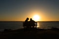 Seniors couple enjoying colorful sunset Royalty Free Stock Photo