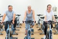 Seniors on exercise bikes in spinning class at gym Royalty Free Stock Photo