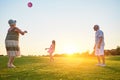 Seniors with grandchild playing ball. Royalty Free Stock Photo