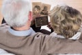 Seniors looking at old pictures Royalty Free Stock Photo