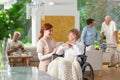 Seniors in a luxury living room of a private retirement home. Te Royalty Free Stock Photo