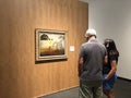 Seniors at museum watching famous art