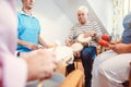 Seniors in nursing home making music with rhythm instruments Royalty Free Stock Photo