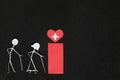 Seniors or old people access to healthcare concept. Elderly couple stick figure beside red health icon in dark black background