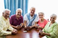 Seniors playing cards together Royalty Free Stock Photo