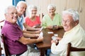 Seniors playing cards together Royalty Free Stock Photo