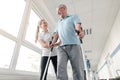 Seniors in rehabilitation learning how to walk with crutches