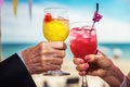 Seniors relish cocktails, beach view, and retirement Royalty Free Stock Photo