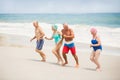 Seniors running at the beach Royalty Free Stock Photo