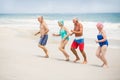 Seniors running at the beach Royalty Free Stock Photo