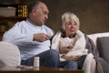 Seniors sitting on the couch Royalty Free Stock Photo