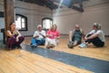Seniors sitting on floor in dance studio Royalty Free Stock Photo