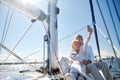 Seniors with smartphone taking selfie on yacht