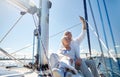 Seniors with smartphone taking selfie on yacht