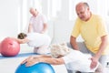 Seniors stretching at the gym Royalty Free Stock Photo