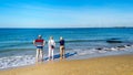 Seniors wading in the Noodzee at the sandy beach of Banjaardstrand along the Oosterschelde Royalty Free Stock Photo