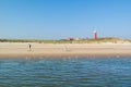 Seniors walking on beach of Texel island, Netherlands Royalty Free Stock Photo