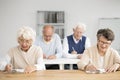 Seniors writing test Royalty Free Stock Photo