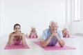 Seniors and yoga instructor