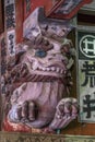 Senjafuda votive slips and Shishi Lion Nosing wooden carved guardian of Kitaguchi Hongu Fuji Sengen Jinja shinto shrine