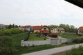 Senkvice, Slovakia - April, 2011: small houses, green fields and hills view from railway carriage. Royalty Free Stock Photo