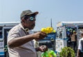 Senoir man selling bubble blower on the street in Colombo town