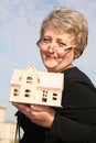 Senoir woman with house Royalty Free Stock Photo