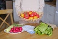 Senora woman holding a basket with farm tomatoes Royalty Free Stock Photo