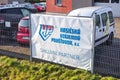 Banner of HVP (Hasicska Vzajemna Pojistovna) insurance company at car service garage to handle traffic accidents