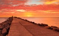 Sensational red sunrise skies at the Breakwall Royalty Free Stock Photo