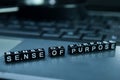 Sense of Purpose text wooden blocks in laptop background. Business and technology concept
