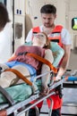 Senseless girl lying on stretcher Royalty Free Stock Photo