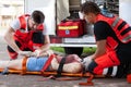 Senseless woman lying on stretcher