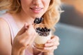 Sensitive young woman eating desert Royalty Free Stock Photo