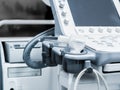 Sensors of ultrasound machine with buttons and monitor. Modern medical equipment. Details. Close-up