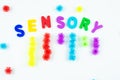 Sensory word and colorful balls that magically bunch. Sensory training, sensory integration, dysfunction and processing