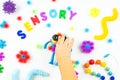 Sensory word and colorful balls that magically bunch. Sensory training, sensory integration, dysfunction and processing