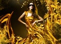 Sensual adult woman in golden fabric