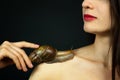 Sensual Beautiful Young Woman with a Snail Ahatin on Her Shoulder Receiving a Cosmetological Procedure. Spa Concept Royalty Free Stock Photo