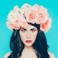 Sensual brunette lady with floral wreath on her head. Royalty Free Stock Photo